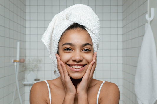 Happy-girl-holding-face-with-clear-skin