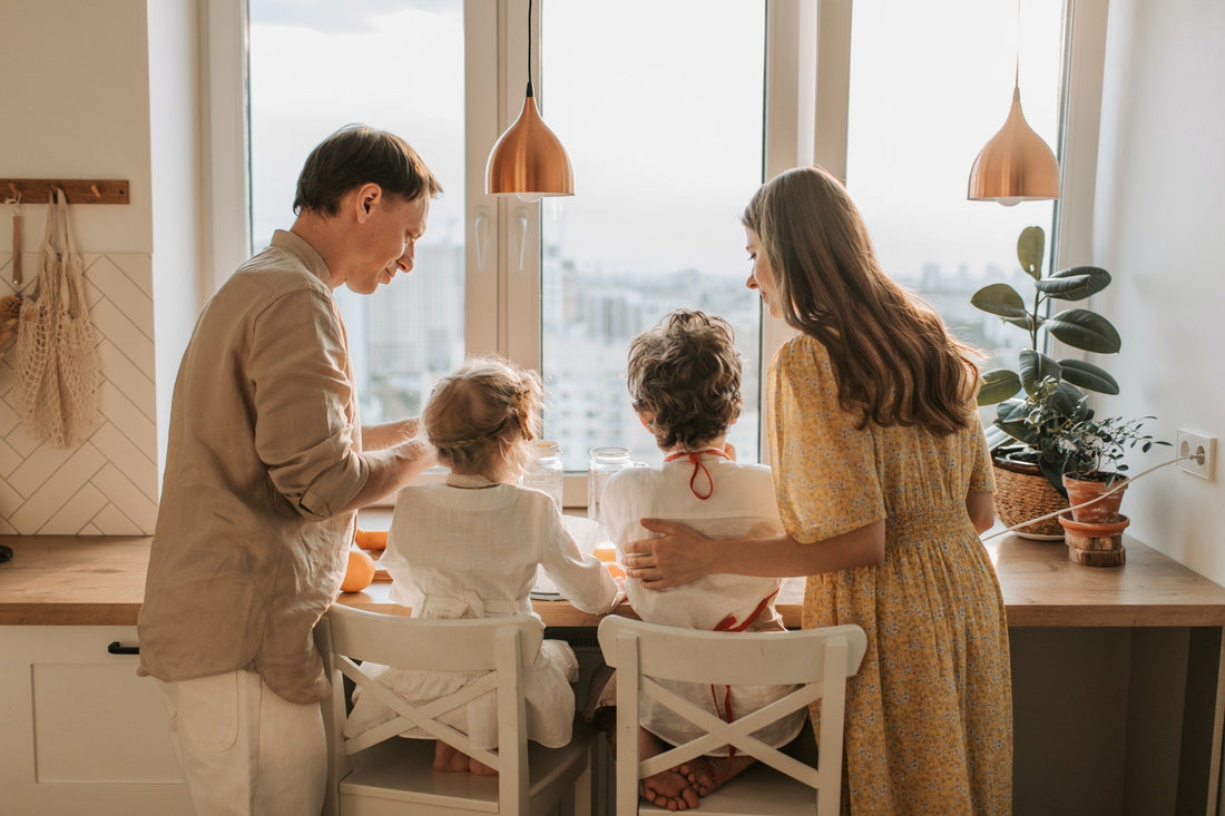 Family-standing-in-kitchen-together