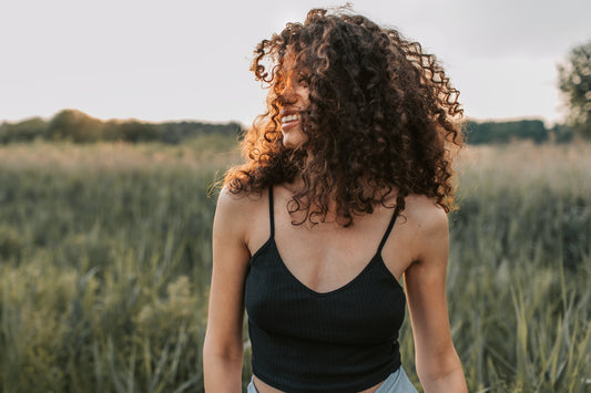 Happy-girl-standing-in-field